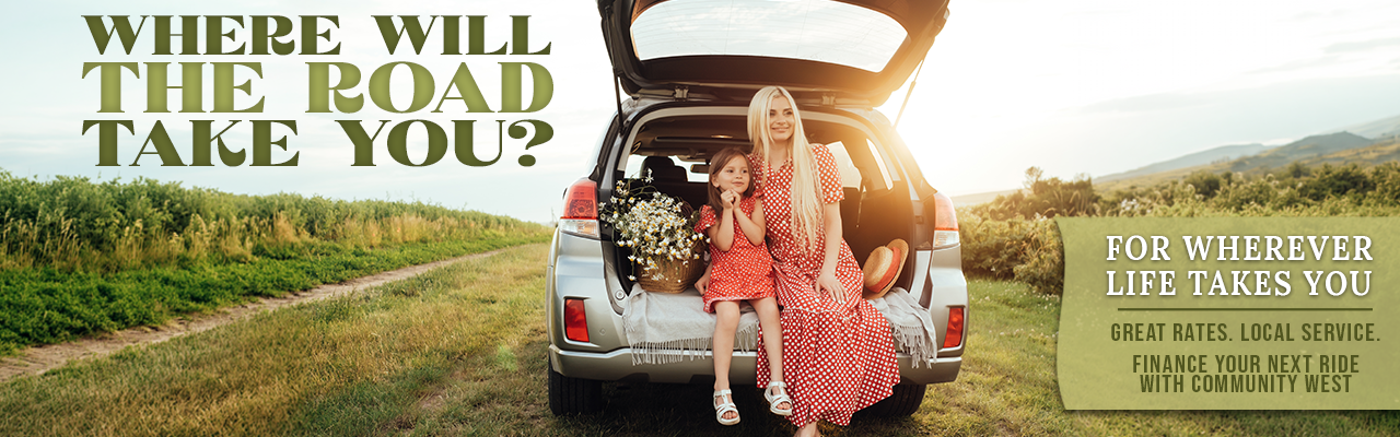 Auto Spring - Community West Credit Union Young woman and child sitting in the back of a trunk in a meadow.