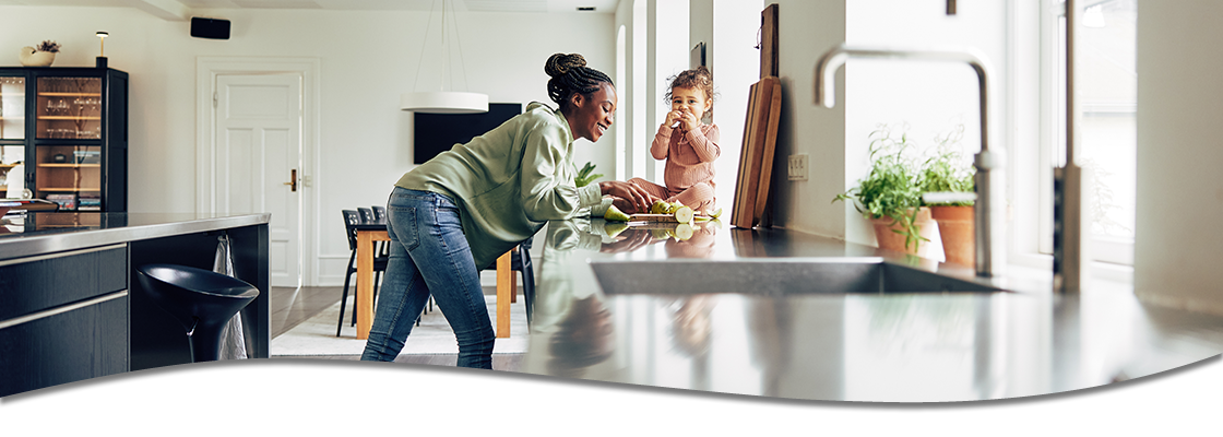 Mother and Child eating snack in house