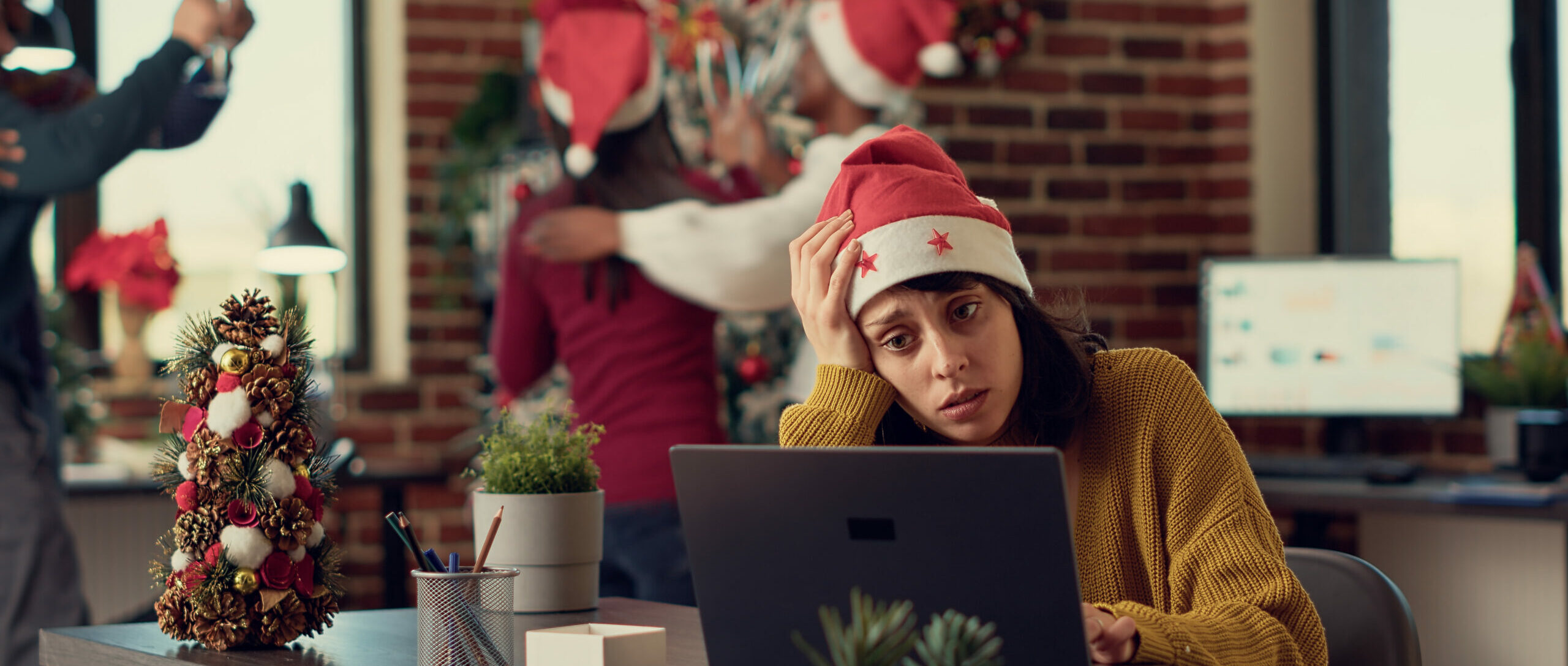 Festive people disturbing stressed woman during christmas time