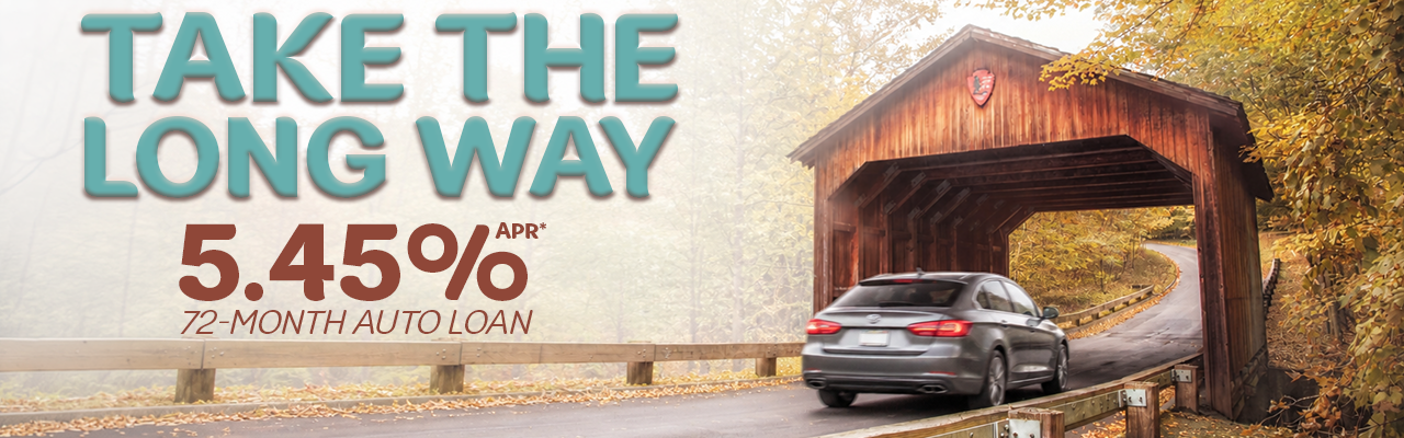 Car driving through a covered bridge. Text: "Take the long way. 5.45%APR* 72-Month Auto Loan"